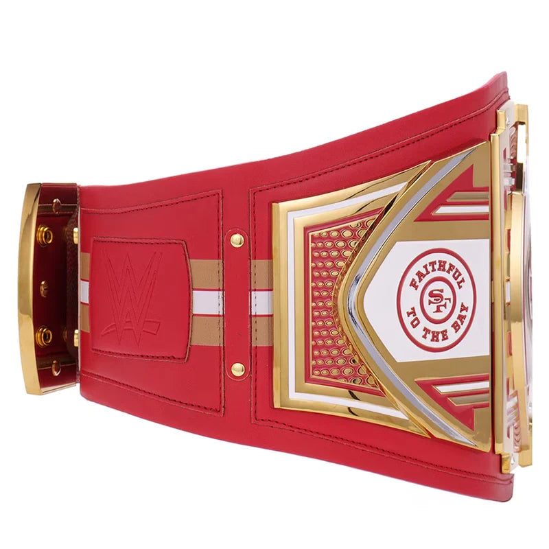 Red and gold championship belt with a central emblem on a white background