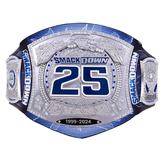 A custom championship belt featuring a large silver-toned central plate with blue and silver details, the number 25, and 'SMACKDOWN' text, flanked by blue and silver straps on a white background.