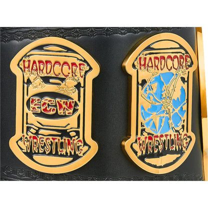 Two ornate championship belt plates on a black textured strap, featuring gold-tone metal borders and lettering. The left plate reads 'HARDCORE ECW WRESTLING' with red and gold details, and the right plate reads 'HARDCORE ECW WRESTLING' with blue and gold details.