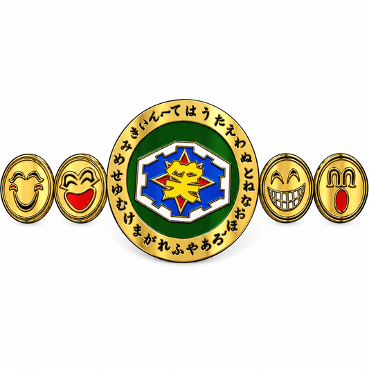 A Japanese-themed belly dance belt featuring a central green and gold medallion with a blue and yellow sun emblem, surrounded by black kanji characters. The belt has four additional gold-toned oval links on each side, decorated with expressive cartoon faces in red, yellow and white.