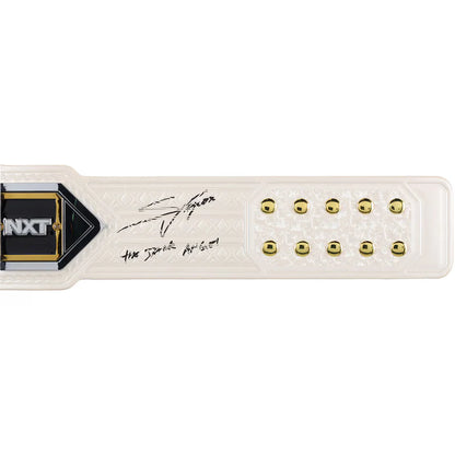 White wrestling belt with gold studs and NXT logo on a white background