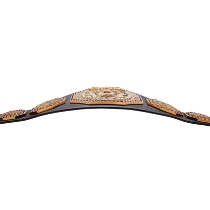 A championship belt with ornate gold-toned plates, dark brown leather straps, and rows of small clear stones, photographed against a plain white background.