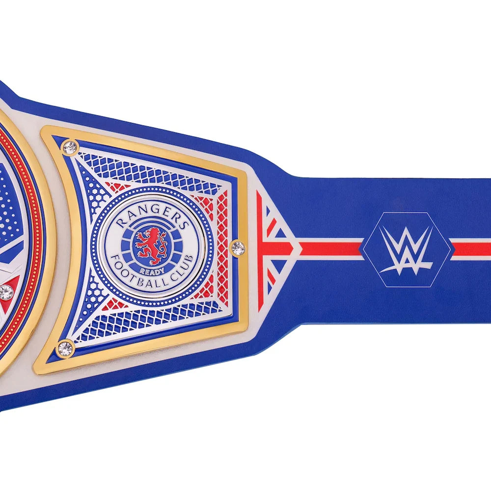 A close-up of a blue and white WWE Rangers Football Club championship belt with gold trim, featuring the WWE logo and Rangers crest on a white background.