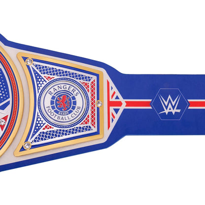 A close-up of a blue and white WWE Rangers Football Club championship belt with gold trim, featuring the WWE logo and Rangers crest on a white background.