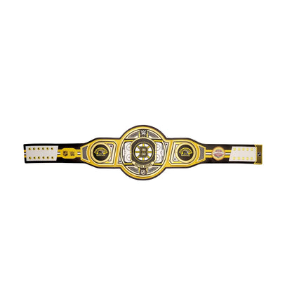 A Boston Bruins championship-style belt with a black strap, gold and silver central plate, and white end sections on a plain white background.
