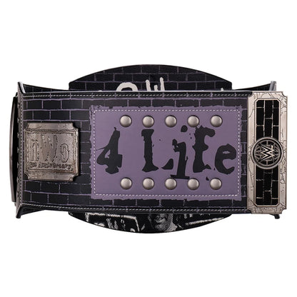 A WWE 4 Time Champion belt featuring a black brick-patterned strap, a central lavender-purple panel with '4 Time' in black text and silver studs, and silver-toned metal hardware on both ends.