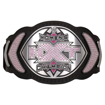 WWE Women's NXT Champion belt featuring a black textured frame, silver metallic lettering, and pink rhinestone accents on a white background.