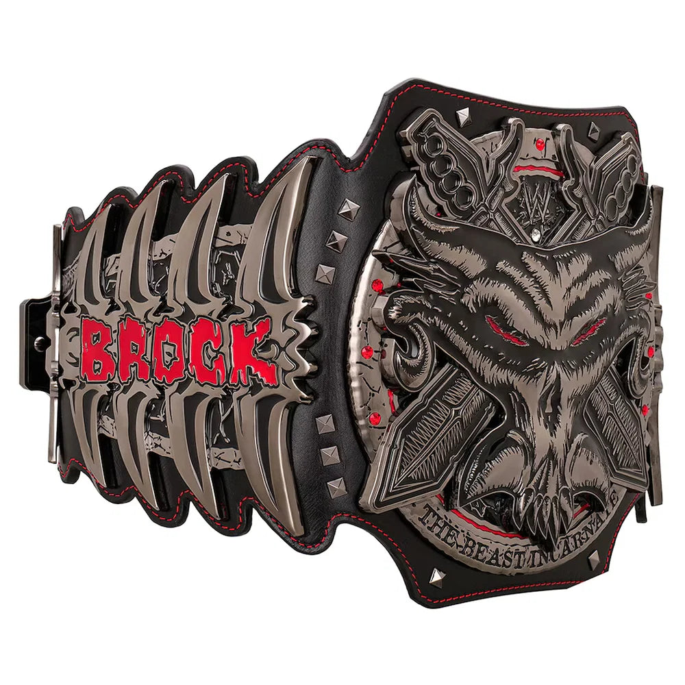 A heavy metal championship belt featuring a large skull with red eyes and the name 'BROCK' in red letters on the left side, with 'THE BEAST IN MIND' on the right, set against a plain white background.
