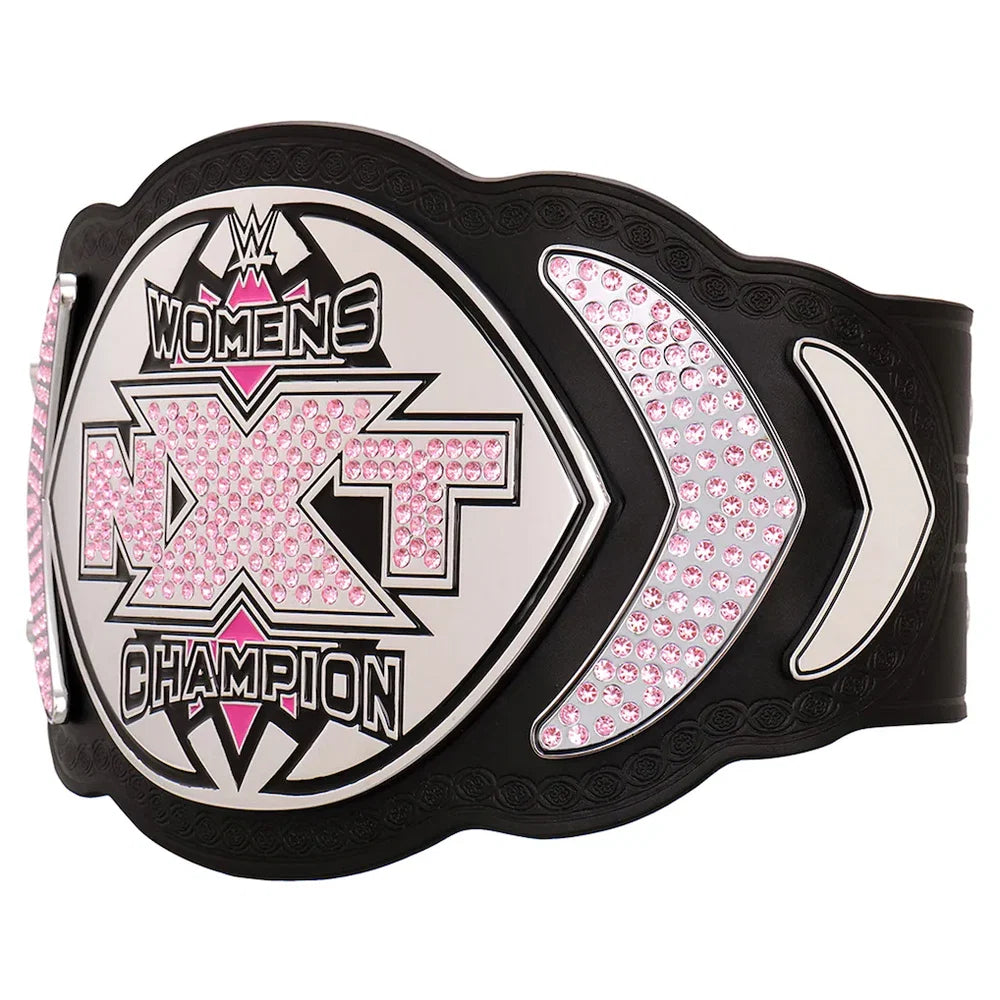 WWE NXT Women's Champion belt featuring a black strap with a large central shield plate and two side plates, embellished with pink rhinestones and silver accents.