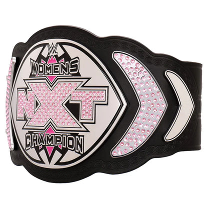 WWE NXT Women's Champion belt featuring a black strap with a large central shield plate and two side plates, embellished with pink rhinestones and silver accents.