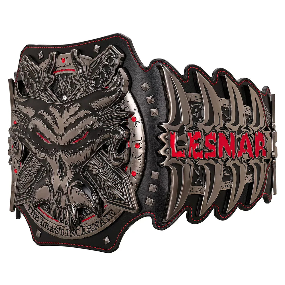 A heavy metal wrestling belt featuring a detailed skull with red eyes, a horned motif, and the red text 'LES NAR' on a black and silver background with red stitching.