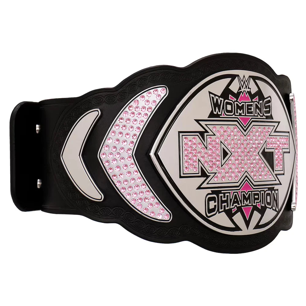 WWE Women's NXT Champion belt featuring a black strap with a large silver and black central plate embellished with pink rhinestones, flanked by matching pink rhinestone sections on a white background.