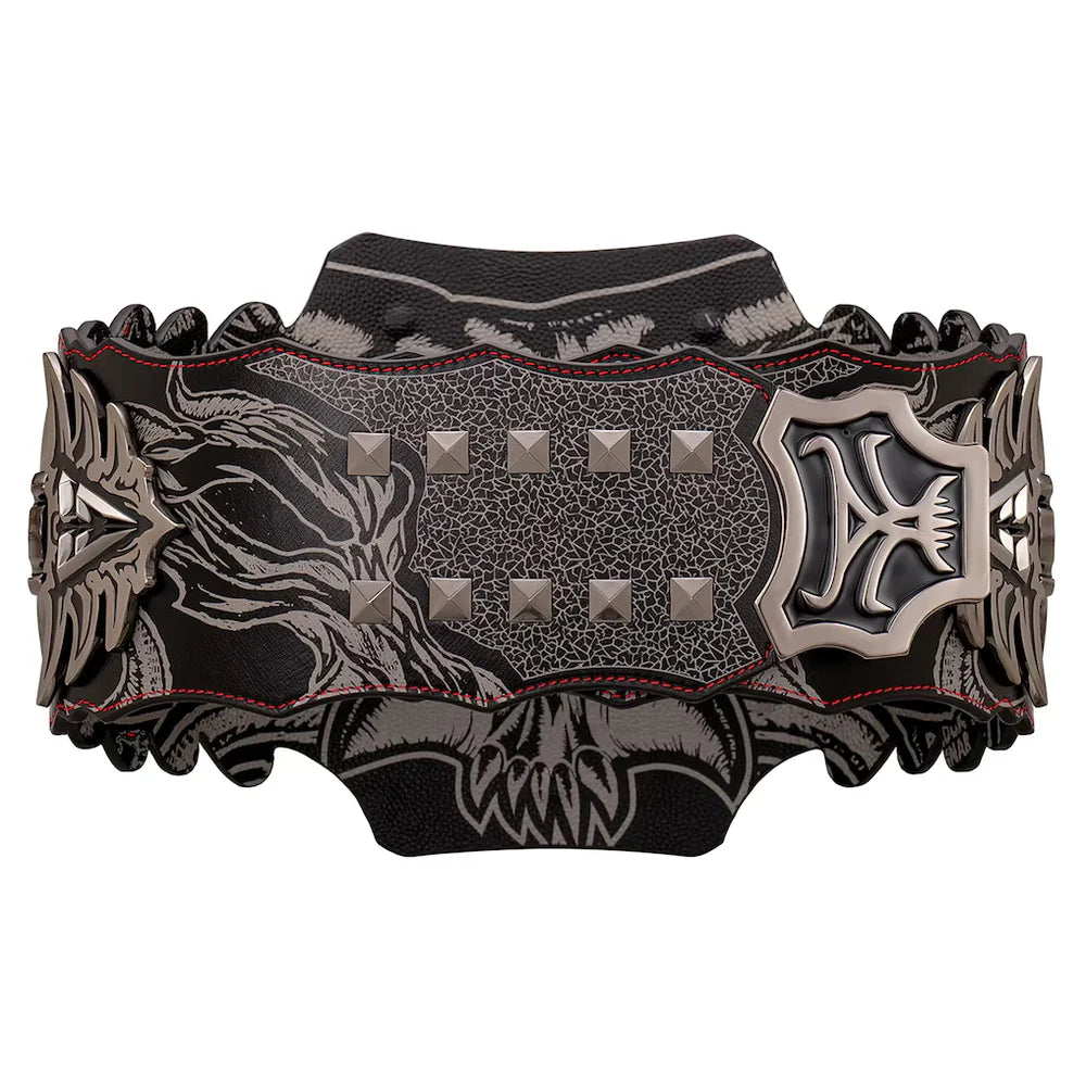 A wide black leather cuff bracelet featuring a detailed silver-toned skull and dragon design, red contrast stitching, and pyramid studs, shown against a plain white background.