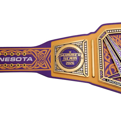 A close-up of a WWE SummerSlam 2026 Minnesota Championship belt, featuring a purple and gold design with crystal accents, on a solid white background.