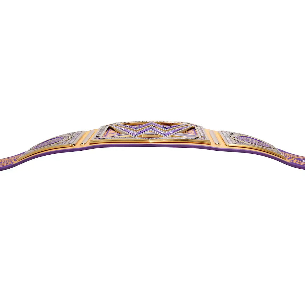 A purple and gold championship belt with intricate purple and gold detailing, shown against a plain white background.