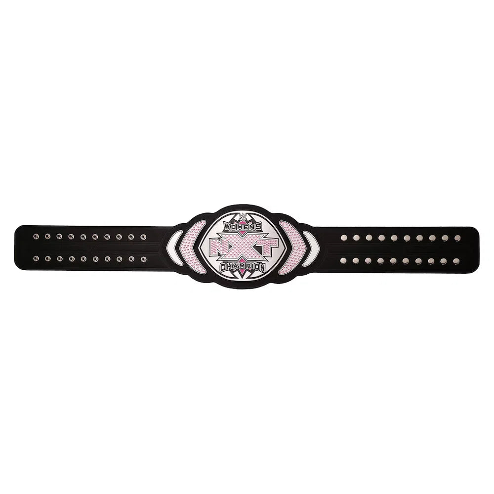 A black championship-style belt with a central oval plate featuring a pink ribbon and the words 'Breast Cancer Champion.' The belt has silver studs and a textured center panel on a plain white background.
