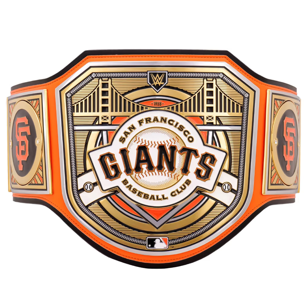 San Francisco Giants baseball club championship belt featuring an ornate gold and white central plaque with the team name, bridge illustration, and San Francisco skyline details, bordered by bright orange straps with orange and black SF logos on the sides.