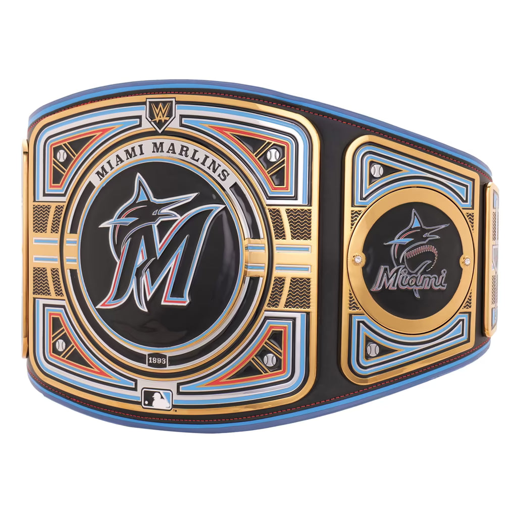 A Miami Marlins championship belt featuring a large central plate with the Marlins logo, a smaller logo plate on the side, and decorative gold, blue, and orange accents on a black background.
