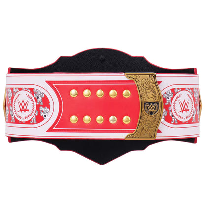 A WWE championship belt replica with a red and white leather strap, gold studs, and a gold central plaque featuring the WWE logo, shown against a plain white background.