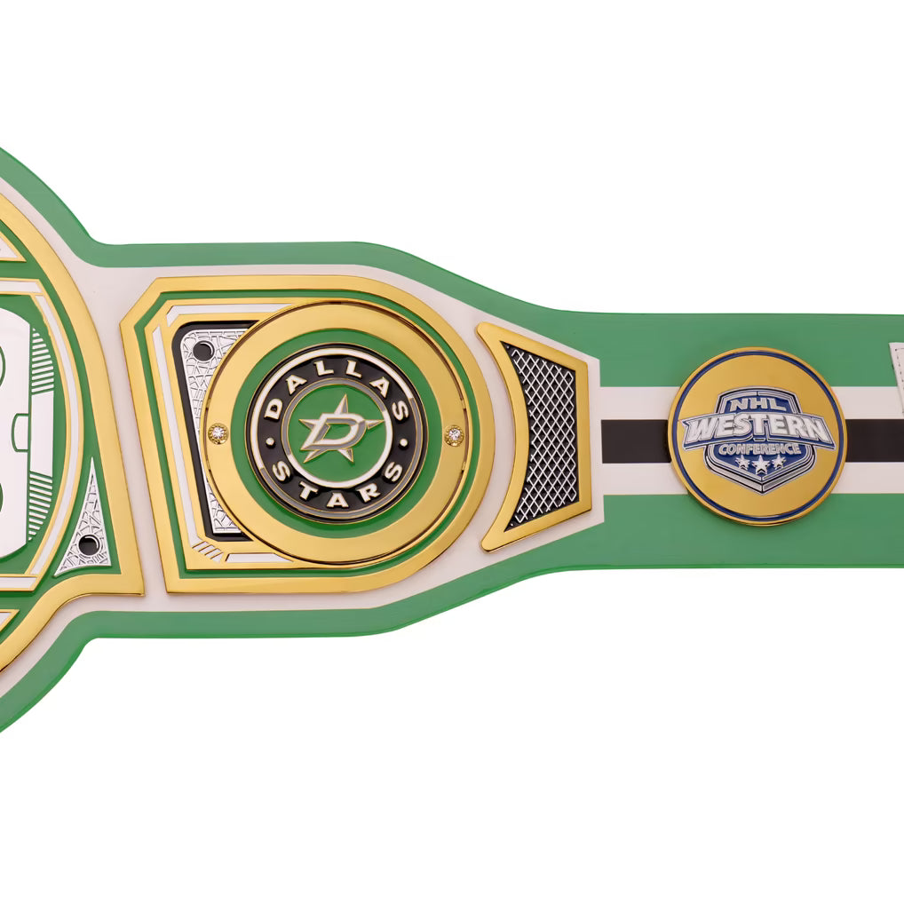 A close-up of a Dallas Stars NHL Western Championship belt, showing the green, gold, and white metal plates with the Dallas Stars logo and an NHL Western Championship logo.