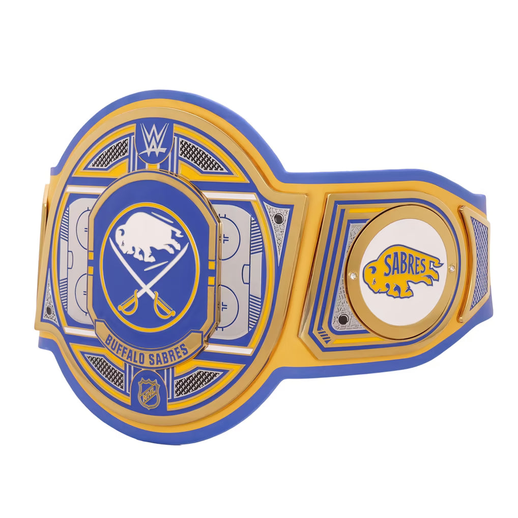 A Buffalo Sabres WWE championship belt featuring a large central plate with the crossed hockey sticks logo, a smaller round Sabres emblem on the side, and WWE branding at the top, shown on a plain white background.
