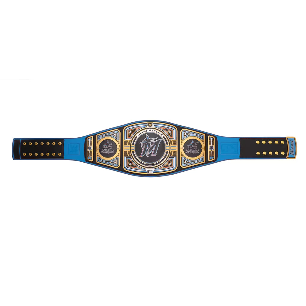 A blue and black wrestling championship belt with gold trim and silver-toned medallions, displayed horizontally against a plain white background.