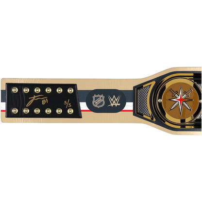 A WWE and NHL championship belt shown horizontally against a plain white background. The belt features a gold-toned metal frame, a black central plaque with the WWE and NHL logos, a signature on the left, and a circular gold-toned medallion with a red and white star on the right.