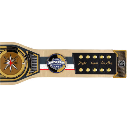 A commemorative hockey championship belt featuring the 2021 Conn Smythe award. The belt has a light wood-grain base with black and gold accents, a gold star emblem on the left, a central circular 'Core Western Conference Champions' badge, and a black plaque on the right with gold '2021 Conn Smythe' script and NHL logo.