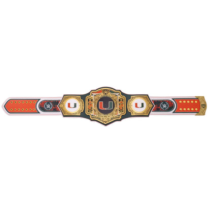 A replica championship belt featuring the University of Miami logo, with a central gold and black plaque, two white 'U' medallions, and red and white end sections on a plain white background.