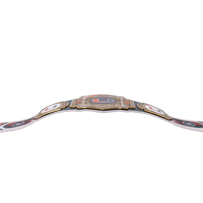 A championship belt with a black strap, gold trim, and a central ornate gold plate featuring a red and blue flag design, photographed against a solid white background.