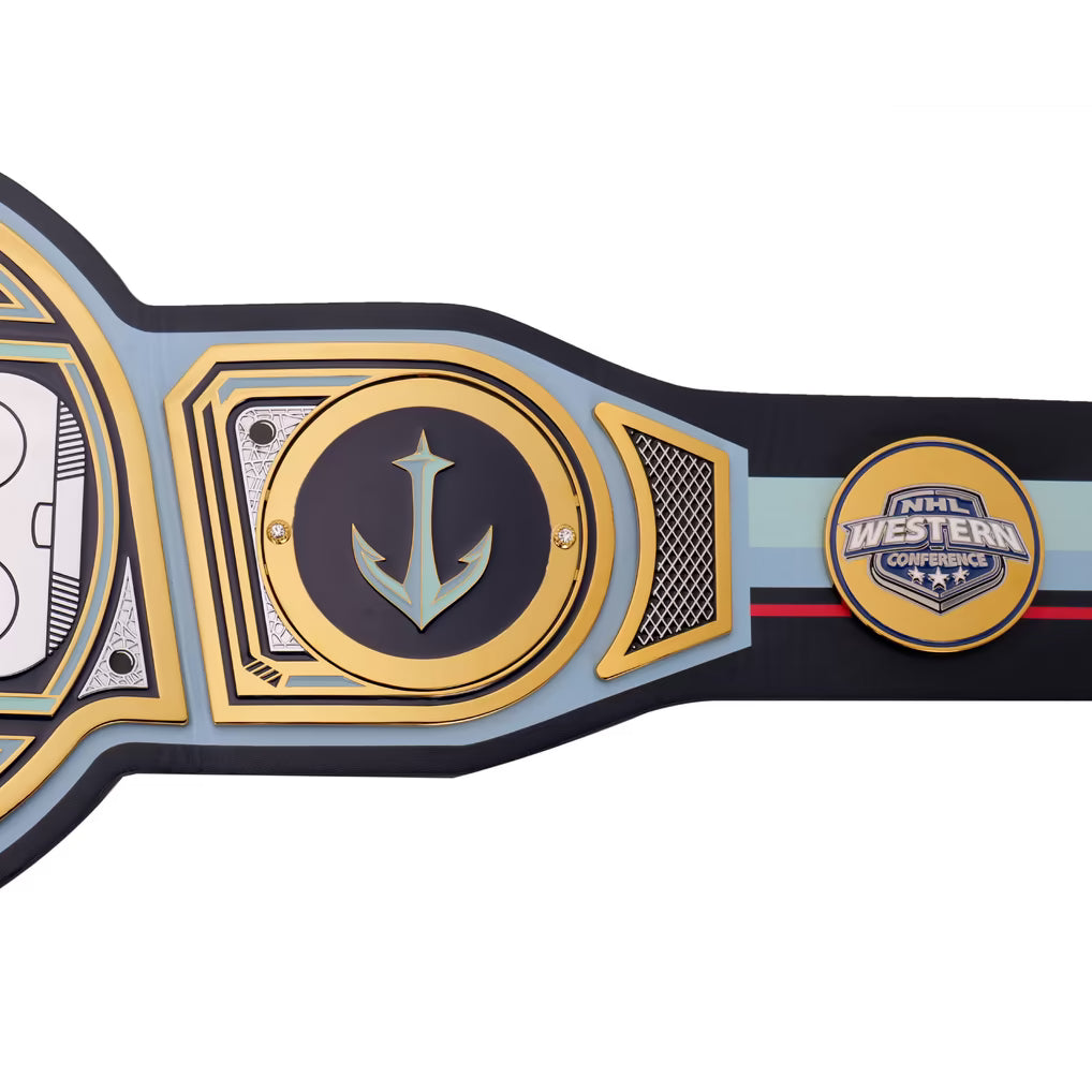 A close-up of a championship-style belt with a large central gold and black anchor emblem, side plates, and a round '2024 Western Conference' patch on a white background.