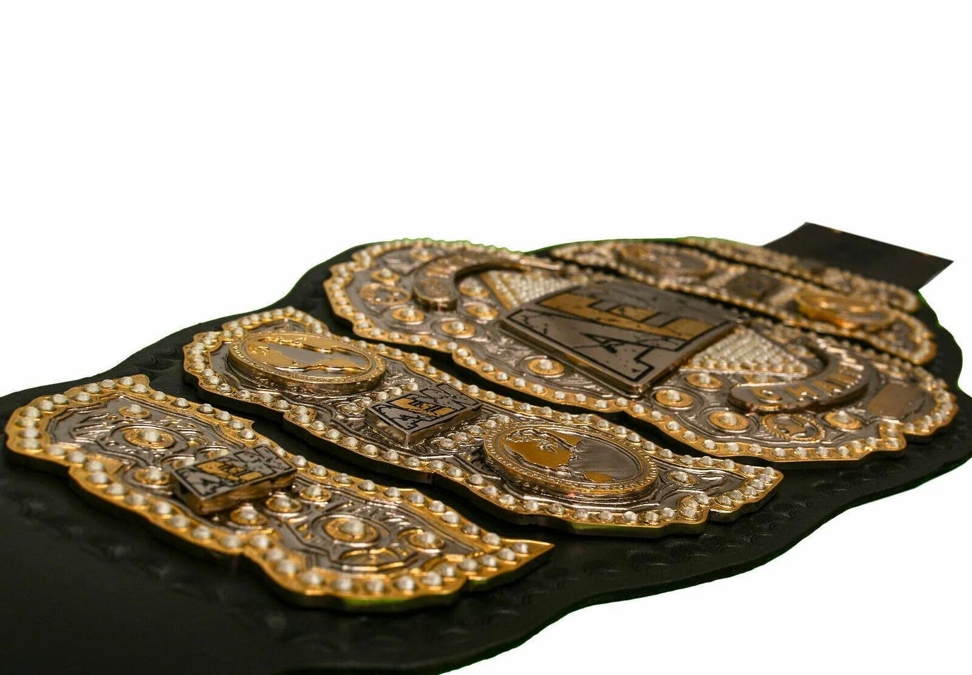 Decorative belt with gold and silver accents on a white background