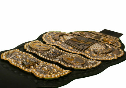 Decorative belt with gold and silver accents on a white background