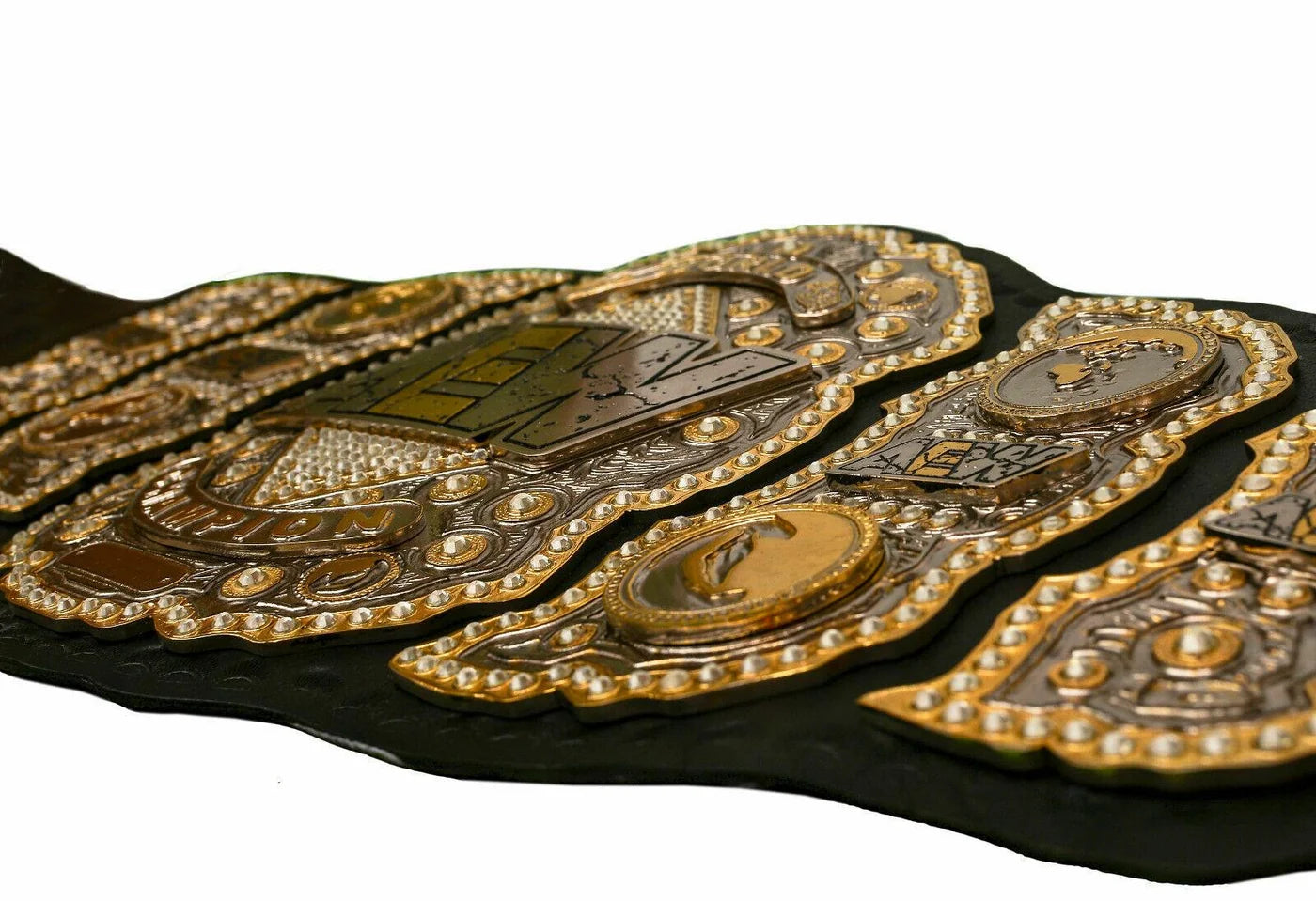 Wrestling championship belt with gold and black design on a white background