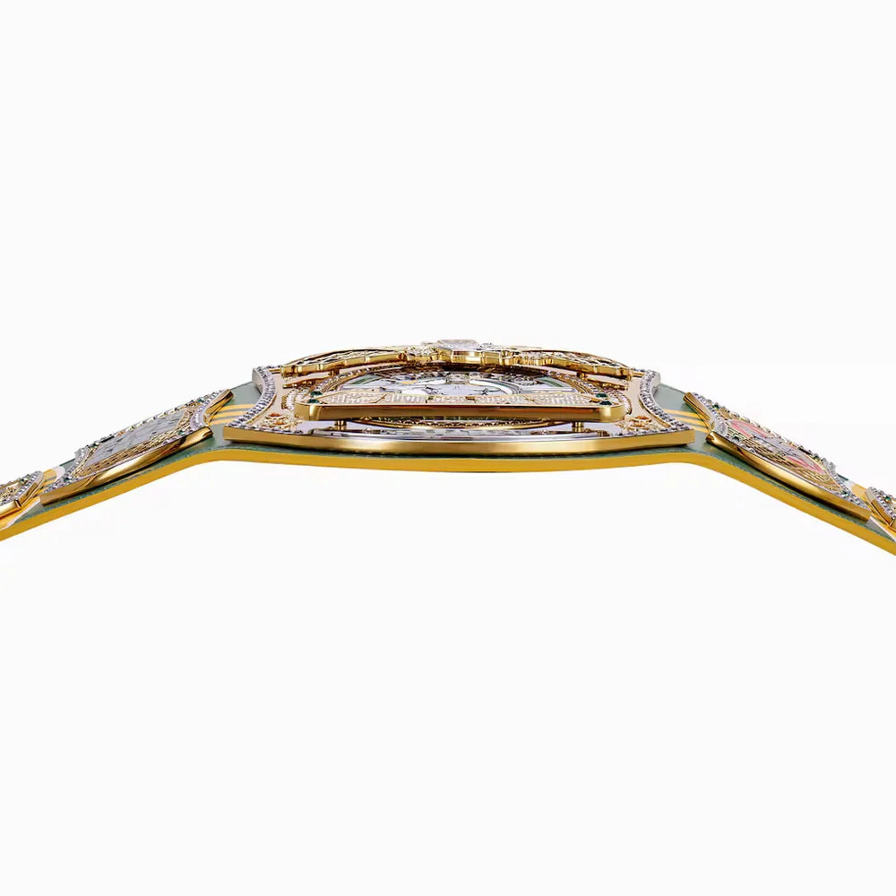 Close-up of a championship belt with a gold-toned central plate and silver-toned side straps on a plain white background.