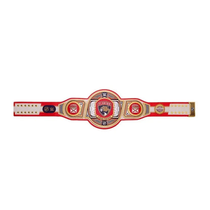 Red and gold championship belt with logos on a white background