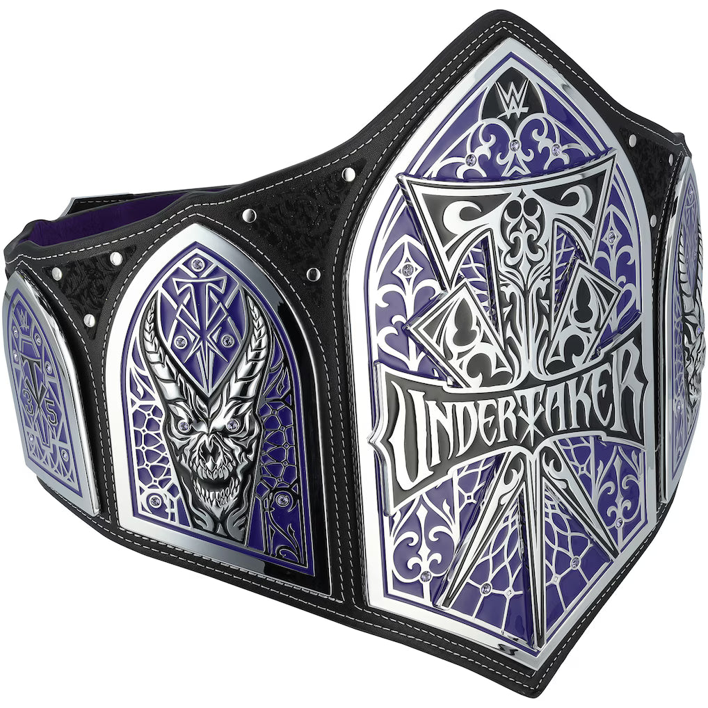 WWE Undertaker Championship belt featuring purple and silver arched panels with a skull and the Undertaker name, bordered by black leather straps with silver rivets.