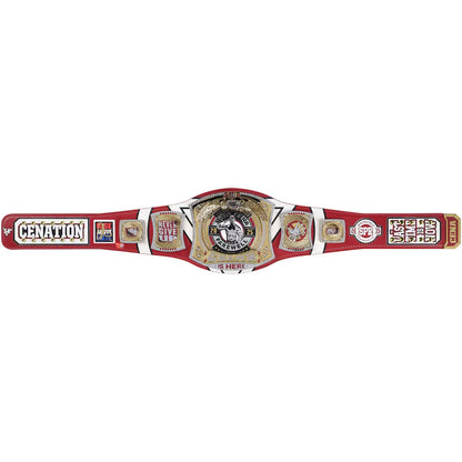 A replica of the WWE Championship belt, featuring a red strap with gold and silver metallic plates, displayed horizontally against a plain white background.