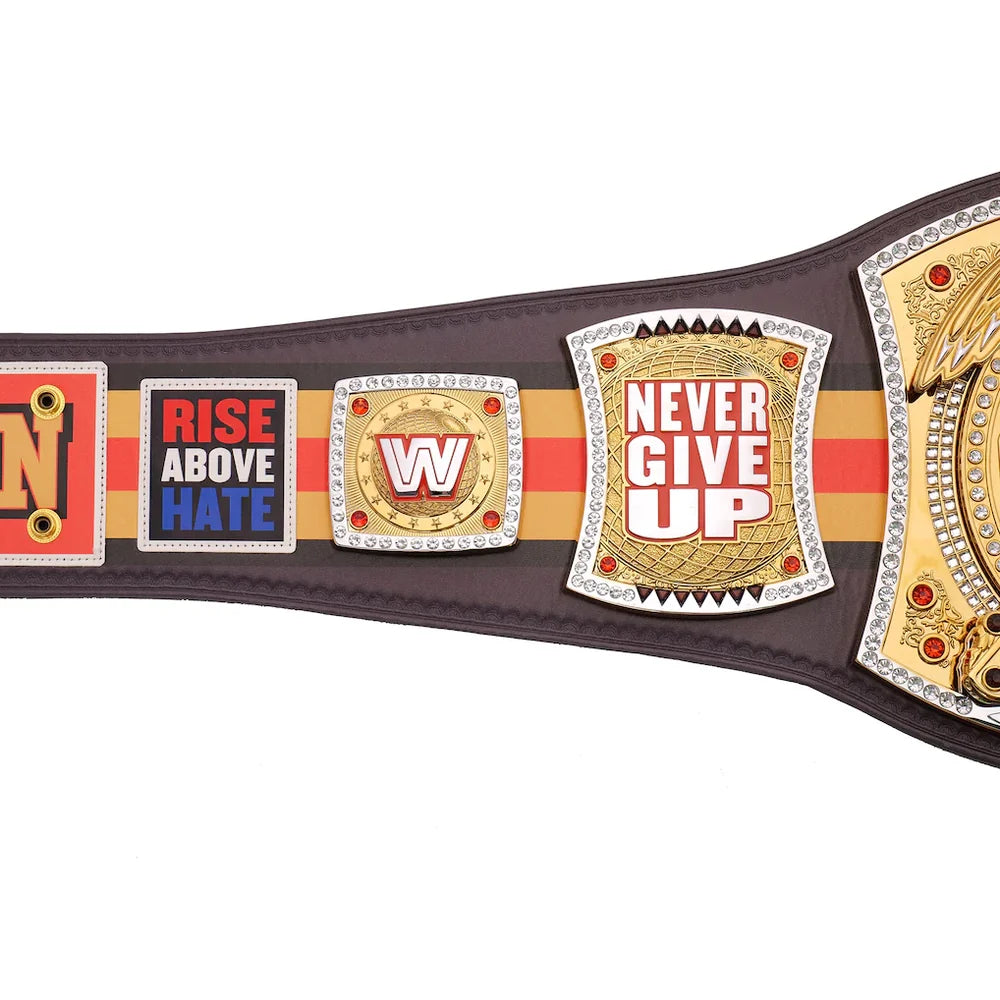 A replica of the WWE Championship belt shown against a plain white background, featuring brown leather straps, gold and silver metal plates, and red and orange accents.