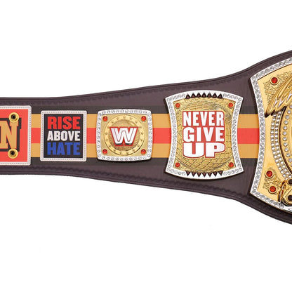 A replica of the WWE Championship belt shown against a plain white background, featuring brown leather straps, gold and silver metal plates, and red and orange accents.
