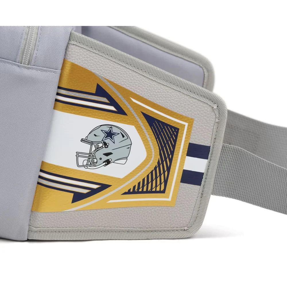 A close-up of a gray sports armband featuring the Dallas Cowboys helmet logo, with gold, white, and navy graphic accents and an elastic strap.