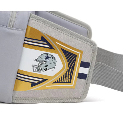 A close-up of a gray sports armband featuring the Dallas Cowboys helmet logo, with gold, white, and navy graphic accents and an elastic strap.