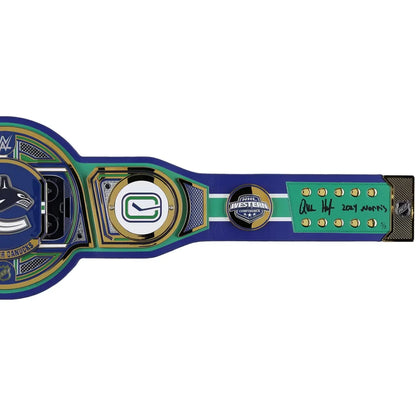A Vancouver Canucks hockey commemorative belt replica or plaque on a plain white background. The item features the Canucks logo, a large 'C' emblem, a '2022 All-Star' patch, and a green panel with gold numbers and an autograph.