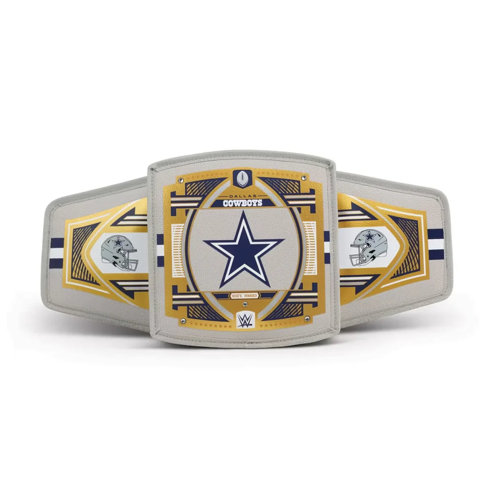 A replica or commemorative Dallas Cowboys championship belt featuring a large central plate with the Cowboys star logo, flanked by two side plates with helmet graphics, all on a light gray background.