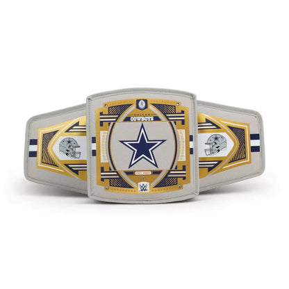 A replica or commemorative Dallas Cowboys championship belt featuring a large central plate with the Cowboys star logo, flanked by two side plates with helmet graphics, all on a light gray background.