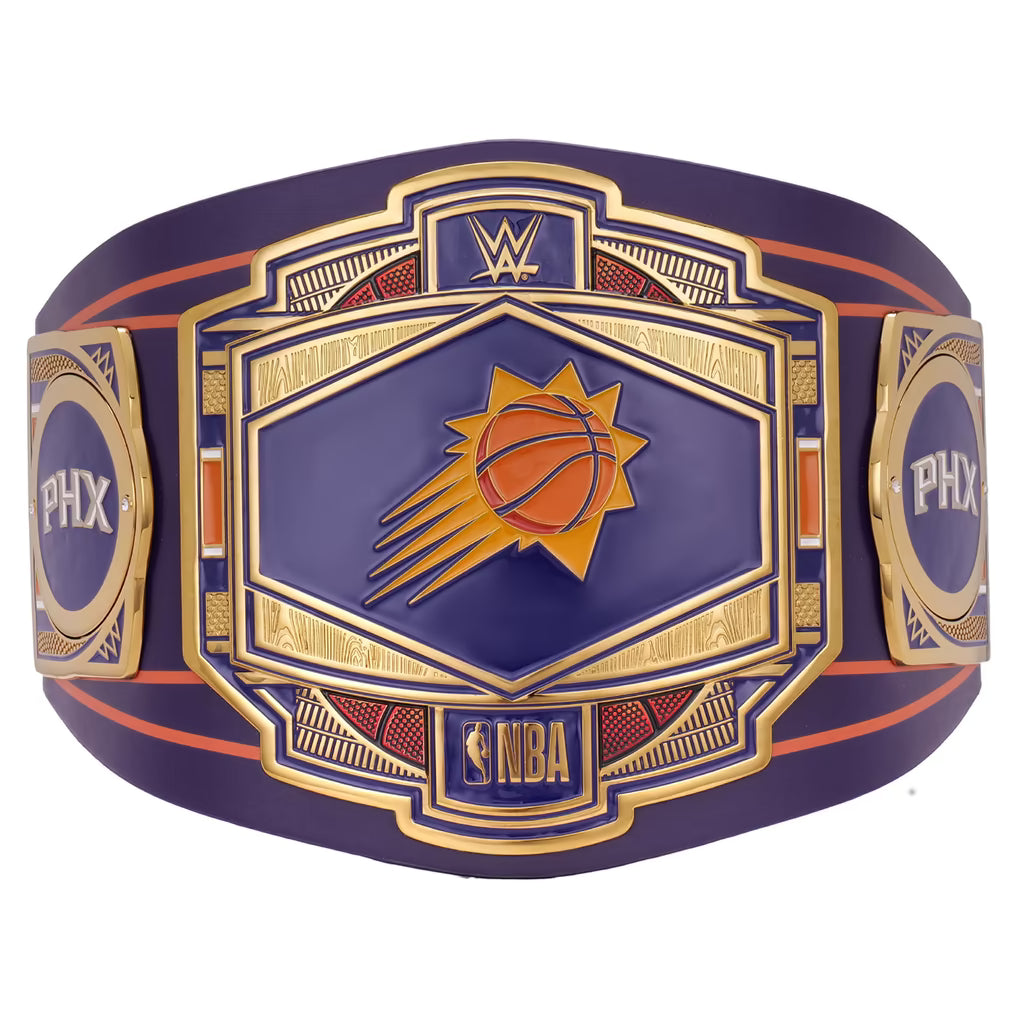 A Phoenix Suns WWE championship belt featuring a purple and gold design with the Suns basketball logo in the center, flanked by WWE and PHX branding.