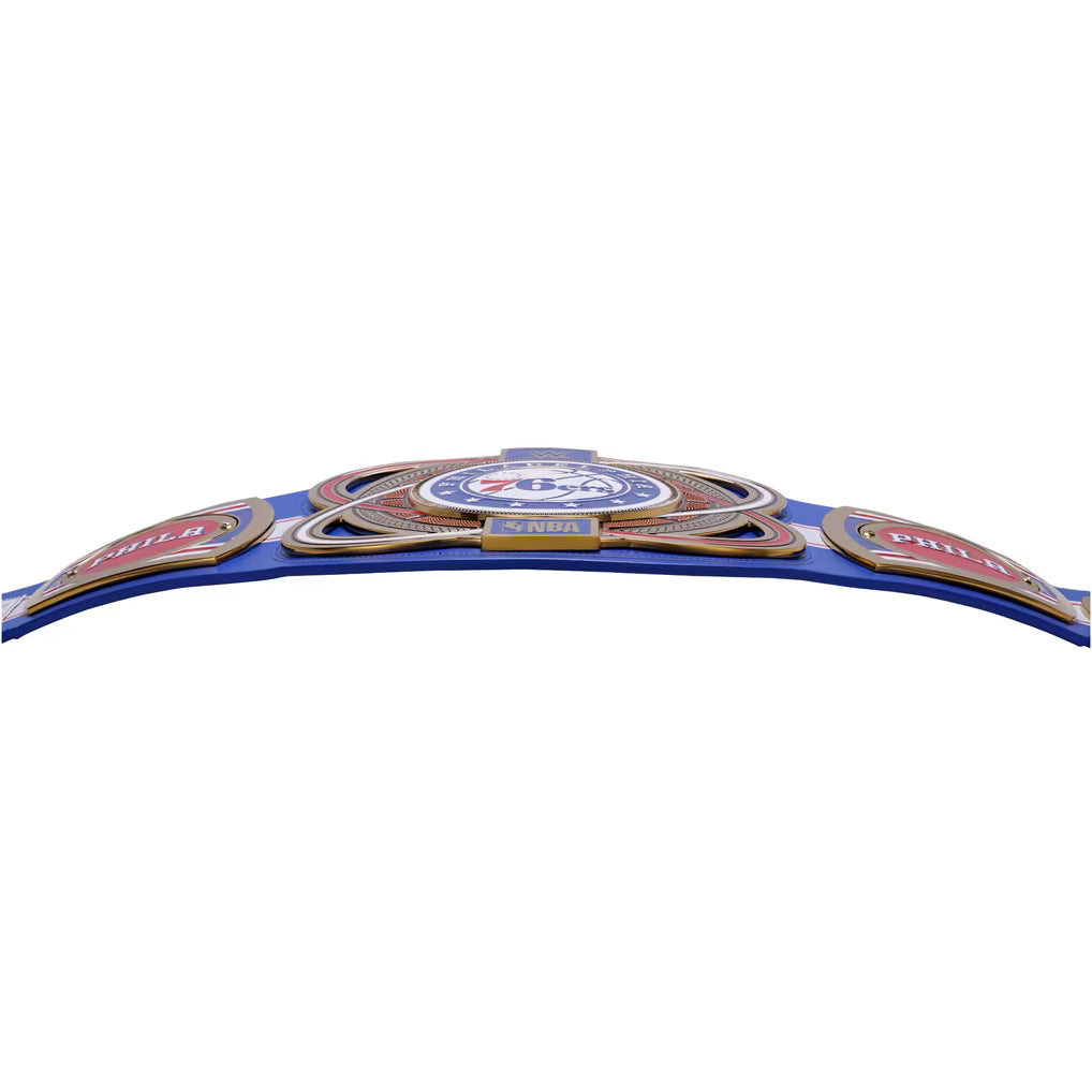 A blue championship belt with gold, red, and white details, featuring the text 'WBA', 'WBC', 'WBO', and 'WBA+'.
