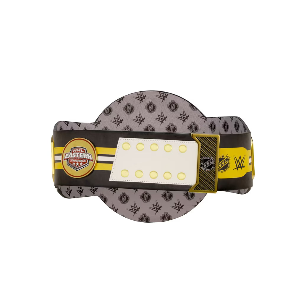 A WWE wrestling championship belt replica featuring a gray and black patterned strap, a yellow and black center band, a white rectangular plate with circular cutouts, and a gold-toned buckle.
