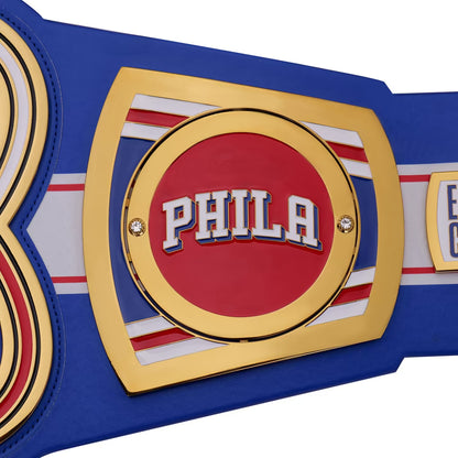 Championship belt with 'PHILA' on a red background