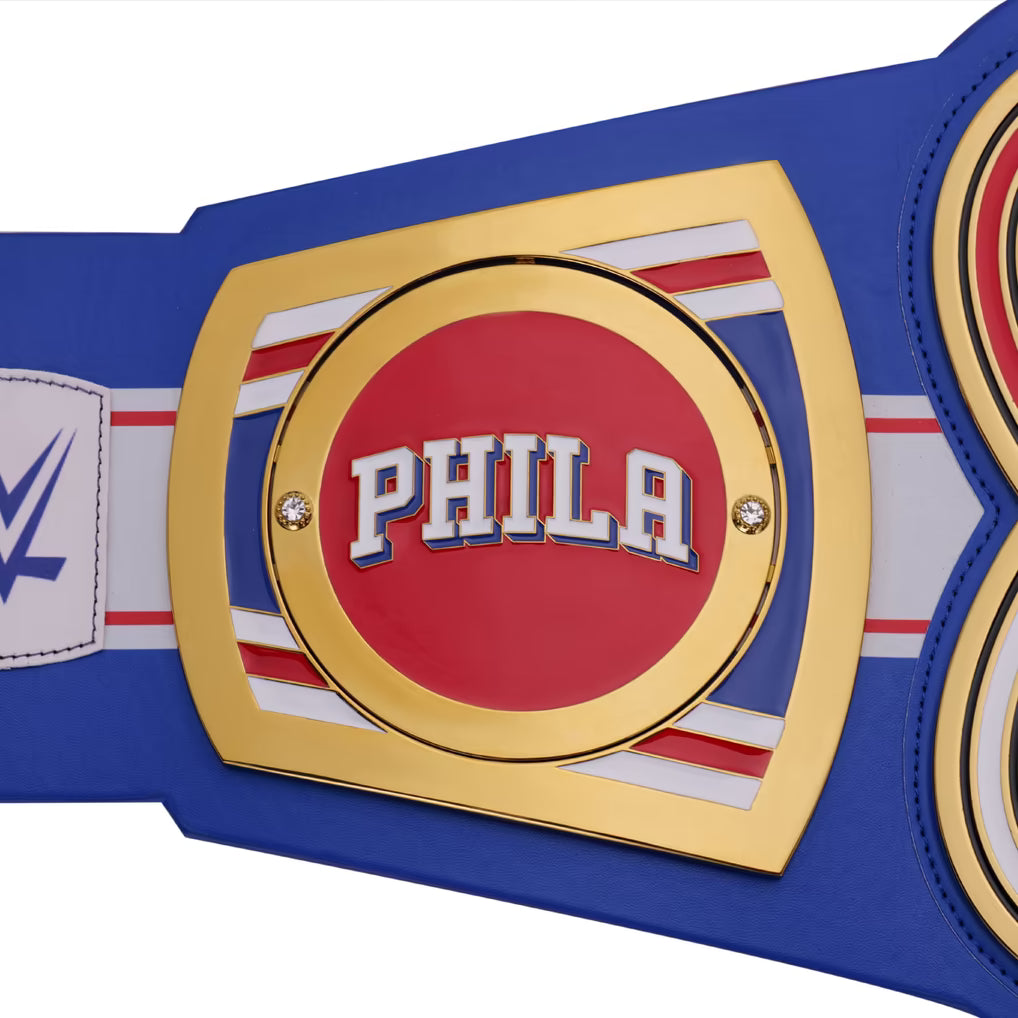 Blue championship belt with a red center displaying 'PHILA' on a white background
